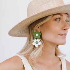 Our stacked flower earrings are back in an updated spring palette of green and white! Color: Green and WhiteDimensions: 2 3/4" x 1 1/2"Light-weight Buffalo HornStainless steel backYour earrings are made from all-natural material and as such the horn color may vary slightly from what is shown. While all horn is very similar in appearance, no two are exactly the same. This guarantees the uniqueness of each piece and ensures your amazing jewelry is truly one of a kind! The horn for this piece is so Green Flower Earrings For Spring, Green Flower-shaped Earrings For Summer, Green Flower-shaped Earrings For Spring, Green Flower Shaped Earrings For Spring, Green Flower Shape Earrings For Spring, Green Flower Charm Earrings, Spring Palette, The Horn, Dress Hats