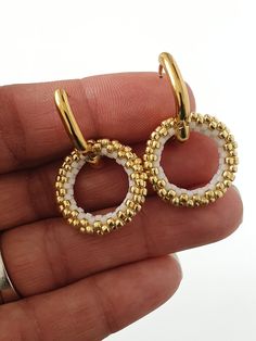 Miyuki Beaded Gold Hoop Earrings Discover the glamour and timeless elegance with these earrings in high quality stainless steel, decorated with a ring woven in Miyuki beads, handmade.  The earrings I make with Miyuki beads can be customized with the color of your choice, do not hesitate to contact me for more information. Description of the earrings Hand woven Miyuki beads 20mm Stainless steel oval hoop earring 16x13mm To see the whole collection, click here: https://www.etsy.com/shop/AQBijouter Metal Hoop Beaded Earrings For Pierced Ears, Beaded Metal Hoop Earrings, Metal Hoop Beaded Earrings, Gold Beaded Metal Hoop Earrings As Gift, Round Metal Earrings With Gold Beads, Beaded Small Hoop Earrings In Metal, Metal Hoop Beaded Earrings As Gift, Elegant Nickel Free Hoop Beaded Earrings, Elegant Metal Beaded Hoop Earrings