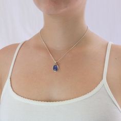 A delicate balance of rich blue and violet, this gem has fine crystal inclusions and an exquisite luster. Wearing this deep blue-hued beauty will add an elegant touch to any outfit. Known as the ‘stone of magic’ it brings its wearer the confidence to turn ideas into reality. Bringing the “will” to start and enhancing from beginning to end. This Tanzanite cabochon stone necklace is also great for Communication and Protection. Stone Origin: ﻿Tanzania Measures Approximately: 15 x 9 mm Materials: Ha Elegant Sapphire Gemstones As Gift, Tanzanite Necklace, Blue Violet, Oval Cabochon, Stone Necklace, Tanzania, Deep Blue, The Stone, 925 Silver