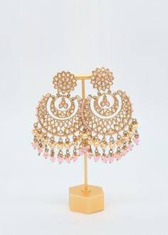 These Polki earrings are a classic addition to any traditional outfit with their stunning stones, crystals, and pearls. They add an exquisite charm and make for the perfect accessory to complete your look. Earrings length: Approx. 3.5" Weight of each earring: 31 gms Push-Back Closure. Antique Gold Plated on high-quality brass as the base metal In-stock & ready-to-ship Color may vary slightly due to light condition & photography. Jewelry Care: Keep away from moisture. Allow perfumes and lotion to Earrings Chandbali, Pearl Tassels, Pakistani Earrings, Tassels Earrings, Photography Jewelry, Polki Earrings, Traditional Outfit, Chandbali Earrings, Indian Earrings