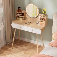 a small desk with a mirror and other items on it