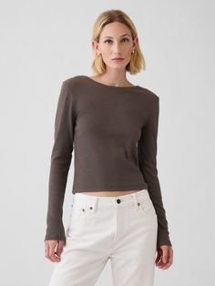 Soft, stretch cotton-modal blend ribbed T-shirt.  Crewneck.  Long sleeves.  Fit: Stretch-to-Fit.  Slim & stretchy that forms to your shape.  Hits at the waist.  Models wearing Gap Fine Knit Stretch T-shirt For Spring, Trendy Stretch Tops By Gap, Trendy Relaxed Fit Gap Tops, Gap Trendy Relaxed Fit Tops, Gap Relaxed Fit Trendy Tops, Trendy Stretch Tops From Gap, Gap Fitted Tops For Fall, Stretch Ribbed Top Made Of Modal, Trendy Ribbed Tops With Minimal Stretch