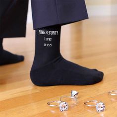 This super cool design for the ring bearer is printed on our black or navy flat knit dress socks or white ribbed crew socks and makes a great wedding accessory and gift. Please enter the name and wedding date to be printed on the socks. Orders with missing information will take longer to process. Personalize a pair of socks for the special day by adding the name and wedding date to the socks. Sock size 6-8 1/2 fits a kids shoe size 9-2, ages 5-9 Cotton/nylon blend Machine wash warm, bleach produ Ring Bearer Navy, Ring Security Wedding, Groom Socks, Ring Security, Ring Bearer Gifts, Wedding Socks, Navy Flats, Personalized Socks, Bleach Product