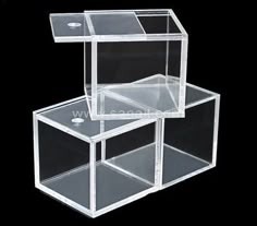 three clear acrylic boxes stacked on top of each other