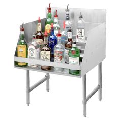 a stainless steel sink filled with lots of bottles