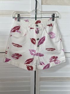 Vintage Copper Key 80s 90s White Denim Shorts Lipstick Kisses High Waist Small Super cute. Rate find. Very high waisted. Medium weight white denim with kisses of red and pinks all over. Button fly. 5 pocket design. Tagged a size 7/8 but will fit a small. Made in the USA. 100% cotton. Measurements laying flat Waist 26" Length 14" Inseam 3.5" Rise 13" Retro White Shorts With Pockets, Vintage High Waist White Shorts, Vintage White Jean Shorts For Spring, Retro White Shorts For Spring, White Retro Shorts For Spring, Vintage White Jean Shorts, White Cotton Retro Bottoms, Vintage White Cotton Jean Shorts, Vintage White Bottoms For Summer