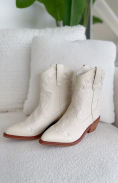 Whether you're stepping out for a day of shopping, heading to a country music concert, or simply looking to add a statement piece to your wardrobe, these boots are sure to turn heads wherever you go! Runs true to size Slip on style Color: Ivory Pointed toe 2.5" heel Patterns may vary Colors may vary from different viewing devices White Boots For Western-themed Fall Events, White Boots For Ranch In Fall, White Mid-calf Boots For Ranch In Fall, Western Style Booties For Rodeo And Spring, White Round Toe Heeled Boots For Western Events, White Heeled Boots For Rodeo In Fall, White Heeled Boots For Fall Rodeo, White Boots For Western-themed Summer Events, White Boots For Summer Western-themed Events