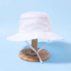 Kids Bucket Hat | Adjustable - Kids Hats - Poshinate Kiddos Baby & Kids Store - View of white hat with strap. Adjustable Fit Solid Color Summer Bucket Hat, Solid Summer Visor Bucket Hat, Solid Color Summer Visor Bucket Hat, Adjustable Fit Bucket Hat With Uv Protection For Beach, Adjustable Solid Bucket Hat For Summer, Summer Sun Hat Visor, Solid Color Visor Sun Hat For Summer, Summer Sun Hat With Upf 50+ For Playtime, Summer Sun Hat With Uv Protection And Adjustable Fit