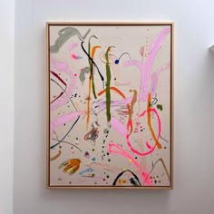 an abstract painting hangs on the wall next to a light fixture in a white room