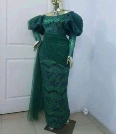 Green lace dress Luxury Traditional Gown With Lace Work, Luxury Green Elegant Lace Dress, Traditional Luxury Gown With Lace Work, Luxury Green Lace Party Dress, Luxury Green Lace Dress, Luxury Green Lace Dress For Party, Emerald Green Lace Bridesmaid Dresses African, Luxury Semi-stitched Lace Work Gown, Lace Sleeves Fitted Bodice Dress For Prom Season