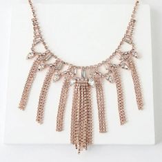 This Rose Gold Rhinestone Statement Necklace Is Sure To Get Some Attention! Clear Rhinestones In Shiny Rose Gold Settings Create An Eye-Catching Display Across This Statement-Making Necklace. Necklace Measures 16.5" Around, With A 2" Extender Chain. Lobster Clasp Closure. Man Made Materials. Glamorous Rose Gold Necklaces For Party, Glamorous Rose Gold Party Necklace, Evening Jewelry In Rose Gold With Rhinestones, Evening Rose Gold Jewelry With Rhinestones, Rose Gold Rhinestone Necklace For Party, Rose Gold Crystal Necklaces For Party, Rose Gold Crystal Necklaces With Rhinestones, Rose Gold Rhinestone Crystal Necklaces, Rose Gold Crystal Necklace With Rhinestones