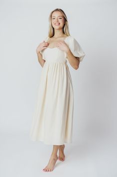 The Hamilton is everything you're looking for in a midi dress - charming, sophisticated, and absolutely flattering. It features premium quality details, like a sweetheart neckline and gorgeous balloon sleeves that can be worn on or off the shoulder. It's an unforgettable choice for every body type, and extra-comfy for expecting mamas! The best part? You can wear this beauty long after your sweet baby arrives! Available in multiple colorways. FIT: Runs true to size. Features a smocked back panel Midi Dress With Ruched And Fitted Bodice For Brunch, Elegant Midi Dress For Brunch, Feminine Cream Midi Dress For Garden Party, Midi Length Dresses With Pleated Sleeves For Garden Party, Knee-length Midi Dress With Ruched Bodice For Brunch, Elegant Midi Length Maxi Dress With Smocked Bodice, Midi Dress With Smocked And Fitted Bodice, Sweetheart Neckline, Brunch Midi Dress With Smocked Bodice And Sweetheart Neckline, Cream Midi Length Dresses With Fitted Bodice