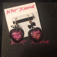 Betsey Johnson - Two-Tone Bow & Crystal Glitter Heart Drop Earrings (Nwt) New. Unused / Unworn With Tags Set In Gold-Tone & Black-Tone Mixed Metal; Glass Plastic: Heart Drop Embellished With Stone Accents And Bow Details Lever Back Closure Approx Drop: 1.3/4” Bj Gift Box Not Included So Sweet & Chic, You’ll Want To Wear These Betsey Johnson Drop Earrings Every Single Day! Matching Necklace Posted Separately. Take Them Both Home! Smoke & Pet Free Environment Cute Party Jewelry With Heart Charm, Cute Heart Charm Jewelry For Parties, Cute Heart Charm Party Jewelry, Cute Heart Shaped Jewelry For Parties, Cute Heart-shaped Jewelry For Party, Cute Heart-shaped Party Jewelry, Cute Jewelry For Valentine's Day Party, Cute Black Jewelry For Party, Valentine's Day Sparkling Heart Earrings For Party