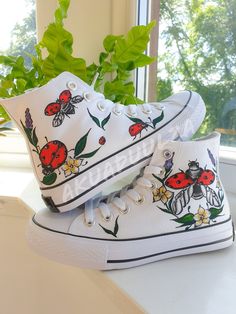 "-🐞BOHO LADYBIRD🐞- 🌈DESCRIPTION: You will receive a unique pair of shoes which I will personally paint by hand just for you.  I create your shoes from scratch by hand in my little studio. The main design is painted on the outside of the shoes only, while on the inside the shoes are painted with the same minimalist decorations to match with the outside. 🔥UNIQUE: As the shoes are PAINTED BY HAND, the design may slightly vary from the picture. Each design is unique in its own way. 🎨CUSTOMISE THEM: As the shoes are made to order, feel free to make them even more unique. In fact it is possible to customise them, adding a text, a date or a name on the inside of the shoes or even in the corner, on the outside next to the characters. Simply leave me a note at the checkout with the details you Hand Painted Canvas Shoes With Round Toe, Hand-painted Canvas Shoes With Round Toe, Hand Painted Round Toe Canvas Shoes, Artistic White Canvas Sneakers, Hand Painted White Low-top Canvas Shoes, White Hand Painted Low-top Canvas Shoes, Hand Painted White Canvas Sneakers, White Hand Painted Canvas Shoes With Round Toe, Artsy Hand Painted White Custom Sneakers