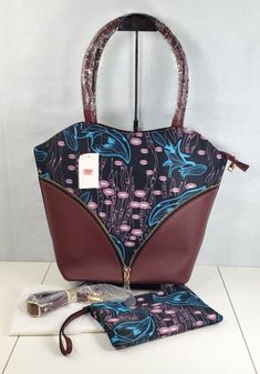 Wine Red Floral Pattern Nylon Faux Leather Tote Bag w/Clutch Set of 2 Wine Red and Floral Pattern Nylon, Faux Leather Tote Bag and Clutch Show your style and class by carrying this stunning set of a tote bag and a clutch. It is made with premium material. This set has ample space to keep all your essentials safe and organized. Carry this bag set when heading outdoor, shopping, traveling, or more. This bag set goes well with any outfit of your choice.PREMIUM MATERIAL: Durable and shiny faux leath Trendy Burgundy Bag With Zipper Closure, Trendy Fabric Bag With Zipper Closure, Rectangular Fabric Bag With Zipper Closure, Fabric Tote Shoulder Bag With Zipper, Fabric Tote Shoulder Bag With Zipper Closure, Burgundy Office Bag With Zipper Closure, Red Fabric Shoulder Bag For Shopping, Burgundy Shoulder Bag With Zipper For Daily Use, Burgundy Shoulder Bag With Zipper Closure For Shopping