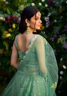 Capture the essence of elegance in this vivid green zari dori embroidered lehenga, meticulously crafted to perfection. Adorned with intricate embroidery, this ensemble exudes sophistication and charm. Paired elegantly with a net dupatta, it's the ideal choice for making a statement at any special occasion. Dori Embroidery, Raw Silk Lehenga, Padded Blouse, Embroidered Lehenga, Traditional Indian Outfits, Belt For Women, Silk Lehenga, Net Dupatta, Fashion App