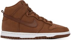 High-top nubuck sneakers in brown. Buffed leather trim throughout. · Perforated detailing at round toe · Lace-up closure · Textile logo patch at padded tongue · Padded collar · Swoosh appliqué at sides · Pull-loop at heel · Treaded rubber sole Please note that this item may be shipped only within North America. Supplier color: Pecan/Pecan-white Nike Sporty Suede High-top Sneakers, Nike Urban Suede Sneakers, Urban Nike Suede Sneakers, Nike Suede Sneakers For Skateboarding, Nike High-top Sneakers With Embossed Logo, High-top Sneakers With Embossed Logo, Brown Skate Shoes With Contrast Sole For Streetwear, Sporty Brown Skate Shoes With Rubber Sole, High-top Sneakers With Embossed Logo For Streetwear