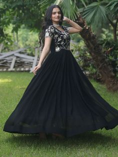 Introducing our stunning "black embroidered georgette reception wear gown" that is sure to make you stand out at any event or function. This black gown features exquisite sequin and embroidered work, adding a touch of elegance and glamour to your look. Crafted from high-quality georgette fabric, this gown is the perfect choice for those special occasions when you want to look and feel your best.
This black reception wear gown is that it comes fully stitched, saving you the hassle of alterations Anarkali Embroidered Maxi Dress For Reception, Sequin Anarkali Dress For Reception, Anarkali Georgette Embroidered Maxi Dress, Evening Lehenga With Floral Embroidery In Georgette, Black Floor-length Dress With Sequins, Semi-stitched Floor-length Embroidered Dress For Reception, Semi-stitched Embroidered Floor-length Dress For Reception, Bollywood Style Embroidered Maxi Dress For Reception, Anarkali Evening Dress With Resham Embroidery For Reception