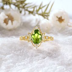 ✥ 𝐌𝐚𝐢𝐧 𝐒𝐭𝐨𝐧𝐞 𝐃𝐞𝐭𝐚𝐢𝐥𝐬 ↣ Shape: Pear Cut ↣ Type: ( Peridot ) ↣ Weight: 1.5 Ct (App.) ↣ Dimension: 6.00*8.00MM MM (App.) ↣ Color: Green ↣ Options: Lab Grown Gem and Natural Gem  (Possible on request while placing an order and Extra Chargeable Service) ✥ 𝐒𝐢𝐝𝐞 𝐒𝐭𝐨𝐧𝐞 𝐃𝐞𝐭𝐚𝐢𝐥𝐬 ↣ Shape: Brilliant Cut ↣ Type: ( Moissanite ) ↣ Weight: 0.15 Ct (App.) ↣ Color/Clarity: Colorless / VVS-VS ↣ Options: Lab Grown Diamond and Natural Diamond (Possible on request while placing an orde Anniversary Diamond Ring With Peridot Birthstone, Anniversary Peridot Birthstone Ring With Gemstone, Green Birthstone Wedding Ring, Elegant Peridot Diamond Ring As A Gift, Oval Peridot Jewelry For Wedding, Fine Jewelry With Peridot And Accent Stones, Peridot Diamond Birthstone Ring For Anniversary, Green Wedding Rings With Gemstone Accents, Green Birthstone Ring With Center Stone For Wedding