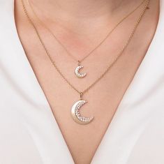 Crafted from 14k yellow gold, this charm exudes elegance and sophistication. The crescent moon shape adds a touch of charm to the design, making it a versatile piece that can be worn for any occasion. The charm measures approximately 3/8'W x 3/8'H. The stunning combination of gold and diamonds creates a luxurious and eye-catching look that is sure to turn heads. Whether worn alone or paired with other charms, this crescent moon charm is a timeless and classic addition to any jewelry ensemble. Fi Celestial Half Moon Yellow Gold Jewelry, Elegant Half Moon 14k Gold Jewelry, Elegant 14k Gold Half Moon Jewelry, Gold Crescent Jewelry With Charms, Celestial Style 14k Gold Half Moon Jewelry, Elegant Moon Shaped Jewelry With Charms, Elegant Moon-shaped Charms Jewelry, Elegant Moon-shaped Jewelry With Charms, Elegant Gold Plated Jewelry With Moon Charm