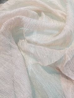 "Metallic off white color krinikled silk organza. 100% Silk Organza. Usable for Apparel and interior designing. End Uses: Apparel,Dresses,Jackets,Slacks,Suits, decorations, blouse, dress etc. Fabric is sold by the yard - to order, select the desired quantity of yards from the drop-down list, each yard will show in your shopping cart as an item but they will ship as one continuous piece Width : 32\" inches Color : Off white Thank you for your coming! Please read policy before placing an order. Pl Elegant Organza Fabric For Wedding, Elegant Wedding Organza Fabric, Elegant Cream Fabric For Party, Cream Elegant Party Fabric, Elegant Beige Tulle Fabric For Party, Elegant Organza Fabric For Party, Elegant Beige Fabric For Wedding, Elegant Cream Sheer Tulle Fabric, Elegant Cream Fabric For Wedding