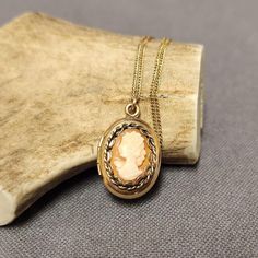 This exquisite vintage cameo locket pendant necklace is a timeless piece that beautifully blends elegance and nostalgia. The locket, crafted from 12k gold-filled material, features a classic cameo design that adds a touch of Victorian charm. Paired with a delicate 14k gold-filled 18" chain, this necklace is the perfect accessory for any vintage jewelry lover. The locket opens, offering a space for a small keepsake or photo, making it both sentimental and stylish. Details: Pendant: 12k Gold Filled Cameo Locket Chain: 14k Gold Filled, 18 inches Style: Vintage Cameo Locket Perfect for collectors or lovers of timeless, classic jewelry Ideal for special occasions or as a thoughtful gift This vintage cameo locket pendant necklace is a piece of history that will add a touch of vintage elegance to Elegant Cameo Jewelry Keepsake, Cameo Medallion Necklace For Keepsake, Elegant Cameo Keepsake Jewelry, Cameo Medallion Locket Necklace Keepsake, Cameo Medallion Locket Necklace For Keepsake, Keepsake Medallion Locket Necklace With Cameo, Rose Gold Cameo Jewelry Gift, Rose Gold Cameo Jewelry For Gifts, Gold Cameo Necklace For Keepsake