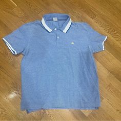 Gorgeous Brooks Brothers Polo Shirt, Unworn Light Blue Cotton Polo Shirt For Summer, Blue Cotton Polo Collar Shirt, Light Blue Cotton Polo Shirt, Casual Blue Cotton Polo Shirt, Light Blue Collared Casual T-shirt, Casual Light Blue Collared T-shirt, Casual Blue Collared Top, Light Blue Cotton Polo Shirt For Spring, Light Blue Cotton Polo Collar Tops