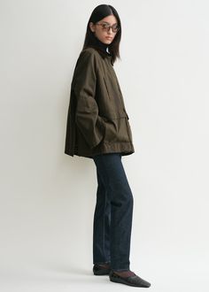 Oversized TOTEME jacket made from waxed cotton sourced from British heritage weavers and dyed in a dark shade of forest green. It’s designed with a very spacious A-line silhouette accented with a brown corduroy collar and elbow patches, a zipper and press-stud front, flap and welt pockets, and two back vents. Wear it as intended or take a smaller size for a more true-to-size look. Waxed Jacket Outfit, Dark Style Outfits, Courdory Jacket, Toteme Jacket, A Line Jacket, Carpenter Jacket, Fall Jackets Outfit, Forest Fashion, Autumn Jacket