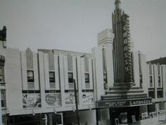 an old black and white photo of a movie theater