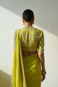 Introducing the mesmerizing soraya sari and blouse set, fashioned from luxurious georgette fabric in a captivating lime green hue. This ensemble comprises two stunning components, meticulously adorned with intricate embroidery including trims, cutwork, and delicate handwork. Elevate your allure with this ethereal ensemble, designed to captivate attention at any special occasion. Pista Green Chanderi Blouse Piece For Reception, Green Georgette Choli With Cutdana, Green Chanderi Saree For Reception, Pista Green Blouse With Resham Embroidery For Reception, Green Pre-draped Saree With Resham Embroidery, Green Chikankari Pre-draped Saree For Diwali, Pista Green Georgette Blouse With Traditional Drape, Green Georgette Blouse For Reception, Green Silk Saree With Resham Embroidery