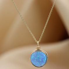 A beautiful large Opal necklace is the perfect statement piece. Set with a genuine 10 mm blue Opal gemstone Most recommended as a set with our beautiful Blue Opal ring :) Link: https://www.etsy.com/il-en/listing/879805308/blue-opal-knot-ring-handmade-ring-opal?ref=shop_home_active_5&pro=1&frs=1 ☆ WHY THIS PIECE OF J E W E L R Y IS AWESOME! ☆ * Hand finished and made from high quality raw materials * Available in Gold filled, Red gold Filled or Sterling Silver * Long lasting beauty & Elegant Blue Necklace For Birthday Gift, Opal Birthstone Necklaces, Round Opal Birthstone Necklaces, Opal Birthstone Round Necklaces, Elegant Blue Jewelry For Birthday Gift, Elegant Opal Necklace With Wire Wrapped Detail, Gold Opal Round Necklaces, Gold Opal Round Necklace, Gold Opal Jewelry With Round Stone