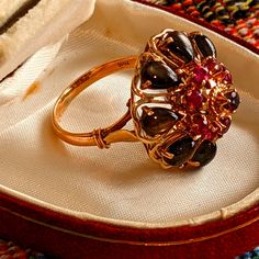 This Listing Is For An Absolutely Breathtaking Vintage/Estate Cocktail Ring. The Ring Is Made Of Solid 14k Yellow Gold. The Center Of The Ring Is Set With Ten Round Natural Rubies Which Are Surrounded With Right (What Look To Be On Your Tigers Eye Pear Shaped Stones. This Ring Is Remarkably Well Made. The Gold Weight Is A Whopping Eight Grams. Heirloom Yellow Gold Cluster Ring With Gemstone, Evening 14k Gold Gemstone Rings, 14k Gold Gemstone Rings For Evening, Victorian Cluster Jewelry For Formal Occasions, Yellow Gold Gemstone Rings For Evening, Fine Jewelry Yellow Gold Rings For Evening, Evening Multi-stone Yellow Gold Jewelry, Evening Yellow Gold Cabochon Jewelry, 14k Gold Rings For Evening Fine Jewelry