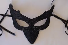 This is the lastest collection to my shop from all the different designs that I have, in large variety in colors and shapes. This mask is perfect for Halloween costumes, comicon and all the fun occasions. This mask like all my all my masks in the shop is very comfortable to wear for the long hours of the occasions. I made this solid black but if you wish this mask in a different color I can definitely change it, that's no problem I'm available anytime so please contact me. I also have one that h Handmade Masquerade Mask For Halloween Cosplay, Handmade Halloween Festival Masquerade Mask, Handmade Fantasy Masquerade Mask For Costume Party, Fitted Costume Mask And Prosthetics, Handmade Costume Accessories For Halloween Masquerade, Handmade Black Masks And Prosthetics For Costume, Handmade Halloween Costume Mask, Handmade Masquerade Mask For Halloween, Handmade Halloween Masquerade Mask