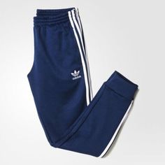 SUPER SPORTSWEAR BRAND NEW!   AUTHENTIC ADIDAS APPAREL ADIDAS ORIGINALS MEN'S SPORTSWEAR COLLECTION     SUPERSTAR CUFFED TRACK PANT   Men's Size: 2XL   Color: Collegiate Navy/White     Classic track pants get a style update with a slim fit and elastic leg cuffs for a modern look. Timeless track pants get a modern look. Updated with a slim fit and elastic leg cuffs, these men's pants show adidas pride with an embroidered Trefoil logo on one hip and 3-Stripes down the legs. They have side pockets Adidas Activewear For Streetwear, Adidas Moisture-wicking Sweatpants For Jogging, Adidas Logo Sweatpants For Training, Adidas Cotton Activewear, Adidas Sportswear Joggers With Moisture-wicking, Adidas Casual Sweatpants For Sports, Adidas Cotton Sporty Activewear, Adidas Athleisure Activewear For Streetwear, Casual Sweat Resistant Activewear For Streetwear