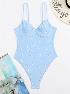 This Absolute Sweetheart Bustier Swimsuit will make you feel gorgeous and confident as you flaunt your style in the sun. Featuring beautiful floral detailing, this swimsuit is sure to turn heads. Poolside Swimwear With Sweetheart Neckline And Built-in Bra, Spring Tankini With Built-in Bra And Underwire, Summer Poolside Bodysuit With Built-in Bra, Spring Underwire Tankini With Built-in Bra, Blue Swimwear With Built-in Bra For Summer, Summer Swimming Bodysuit With Built-in Bra, Trendy Swimwear With Built-in Bra For Spring, Trendy Floral Print Swimwear For Pool, Summer Beachwear Bodysuit With Built-in Bra