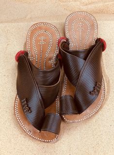 Use code COMBINEDSHIPPING and get $50 off your second pair. Check out all men's leather sandals: https://www.etsy.com/shop/sandcruisers/?section_id=25459641 You will love these traditional Arabian sandals. The straps and soles are made of leather. The leather lining will feel so soft and comfortable against your foot. They are designed to fit your foot loosely with lots of room in the toe-ring and straps. The leather sole will mold and shape to your foot over time, even creating an arch against Open Sandals, Summer Leather Sandals, Mens Slide Sandals, Leather Sandals Handmade, Mens Leather Sandals, Sandals For Men, Brown Leather Sandals, Toe Ring, Palm Beach Sandals