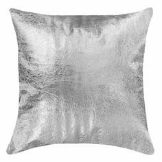 a silver pillow on a white background