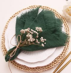 there is a place setting with flowers on the plate