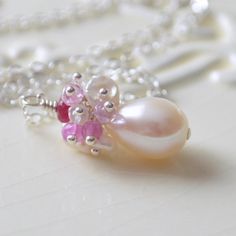 This bridal necklace is a perfect choice for a traditional wedding, where the bride wants just a touch of colour. Its pink and ivory colour combination Wedding Pearl Necklace With Gemstone, Feminine Flower Jewelry For Wedding, Feminine Flower Wedding Jewelry, Feminine Pink Pendant Jewelry, Elegant Pink Pearl Gemstone Necklace, Pink Pearl Pendant Jewelry For Wedding, Pearl White Gemstone Necklace For Wedding, Delicate Pink Necklace With Pearl Pendant, Delicate Gemstone Jewelry For Wedding