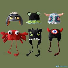 several knitted hats with eyes and horns