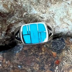 This beautiful Sterling Silver Ring, as part of the Arizona Blue Collection features Kingman Turquoise. Stone Setting: 1/2" x 5/8" The ring is designed by David Rosales, one of the finest contemporary Southwest Artists in the world. He is the founder and co-owner of Supersmiths, Inc. of Gallup, NM. Each ring is custom made and carries a lifetime guarantee. Unique Turquoise Rings With Polished Finish, Unique Rectangular Turquoise Ring, Rectangular Turquoise Ring For Anniversary, Rectangular Turquoise Rings For Anniversary, Modern Turquoise Round Ring, Anniversary Turquoise Rectangular Ring, Anniversary Rectangular Turquoise Ring, Unique Blue Turquoise Ring With Inlay, Turquoise Rings With Polished Finish For Anniversary