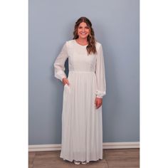 This dress is a great choice for an LDS temple dress. The rayon fabric is lightweight and soft. This dress features bishop sleeves, lace trim work on the bodice and two pockets. This pull on style is easy with a keyhole button in the back and elastic in the back of the waistline for a comfortable fit. Fully lined. Care instructions-Dry clean. Fabric: 100% Rayon Size Bust Length (shoulder to hem) Small 38" 59" Medium 40" 59" Large 44" 60" XL 48" 60" 2X 52" 60" 3X 56" 61" SKU#1023 Modest Daywear Dresses With Smocked Cuffs, Modest Flowy Dress With Elastic Sleeves, Bishop Sleeve Maxi Dress For Daywear, Modest Flowy Rayon Dress, Modest Long Sleeve Dress With Lace Trim, Modest Flowy Dress With Smocked Cuffs, Long Sleeve Peasant Dress With Smocked Cuffs For Daywear, Modest Dress With Smocked Bodice For Daywear, Modest Daywear Dress With Smocked Bodice