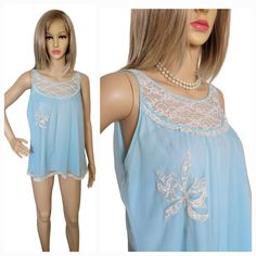 Vintage Movie Star Blue Babydoll Nightgown Nylon with Chiffon overlay Lace Decolletage and Floral Lace Applique Size: Womens M Measurements: Bust 37 in Length 25 in Condition: Pre-Owned  In very good, vintage condition.  Please view all photos and read description.  NOTE: Measurements are of the garment. Please allow room for movement. Nightgown Lace, Vintage Movie Stars, Babydoll Nightgown, Star Blue, Chiffon Overlay, Women's Nightgowns, Pajama Robe, Vintage Movie, Movie Star