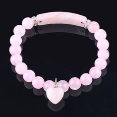 Rose Quartz Bracelet, Alloy Charm Bracelet,Love Bracelet, Women Jewelry, unconditional love bracelet.  Rose Quartz is the love stone! Adds positive love energy to relationships. Compassion and forgiveness. Calming, helps clear stored anger, resentment, jealousy, fears. Replaces negativity with harmony. Helps to balance upper four chakras and eases sexual/emotional imbalances. Enhances self-confidence and creativity. Aids kidneys and circulatory system, promotes release of impurities. The rose quartz crystal can be worn as a bracelet or place a stone under your pillow at night.  Due to the nature of stone formations and our studio lighting, every gemstone product will vary slightly, in shape, size, color, pattern and will not be an exact replica of the one you see in photos. Merchandise enl Pink Crystal Bracelet, Heart Bracelets, Bracelets Beads, Rose Quartz Bracelet, Pink Round, Chakra Bracelet, Heart Gemstone, Rose Quartz Gemstone, Quartz Beads