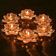 a group of candles sitting on top of a wooden table