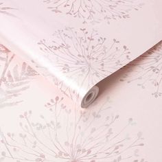 a pink wallpaper with floral designs on it