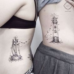 two women with tattoos on their stomachs, one has a lighthouse and the other has a ship