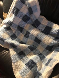 a blanket that is on top of a couch