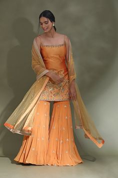 Shop beautiful orange embroidered sharara suit online in USA with dupatta. Look your best at weddings and parties in Indian dresses, designer lehengas, Anarkali suits, designer gowns, salwar suits, sharara suits from Pure Elegance Indian fashion store in USA.-full view Orange Designer Palazzo Set For Navratri, Orange Palazzo Set With Dupatta And Traditional Drape, Semi-stitched Orange Palazzo Set With Gota Work, Traditional Drape Orange Palazzo Set With Dupatta, Orange Palazzo Saree Set For Diwali, Orange Bollywood Designer Palazzo Set, Orange Semi-stitched Palazzo Set For Navratri, Semi-stitched Orange Palazzo Set With Zari Work, Designer Orange Palazzo Set With Zari Work