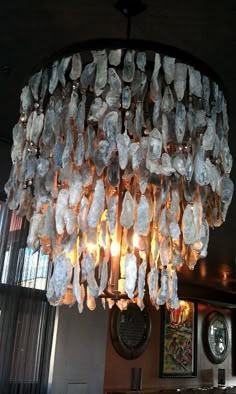 a chandelier made out of plastic bags hanging from the ceiling